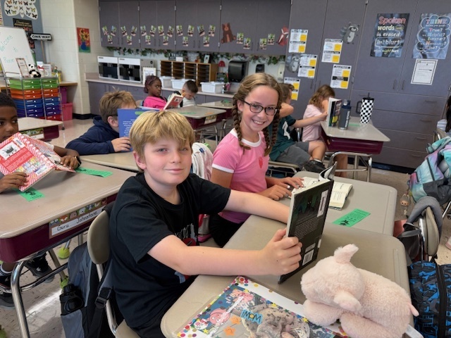 Students reading their books.