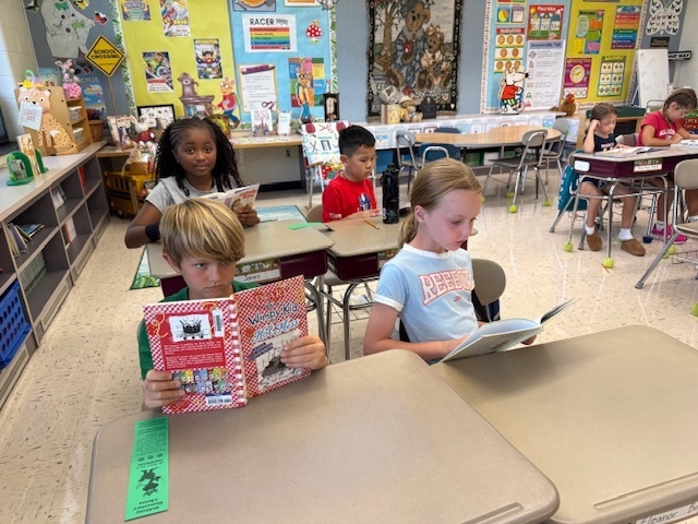 Students reading their books.