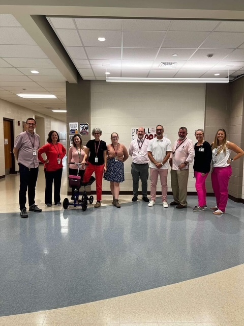 High School staff wearing their pink flair