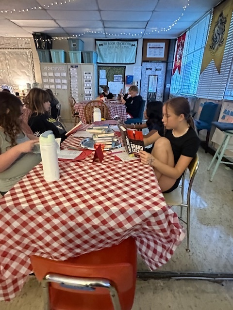 Students sampling books in class at the Book Tasting