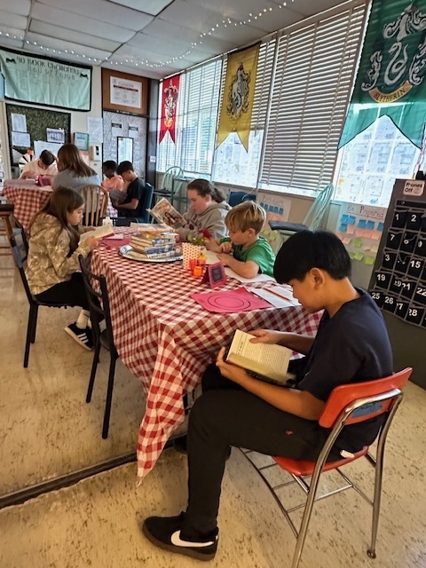 Students sampling books in class at the Book Tasting