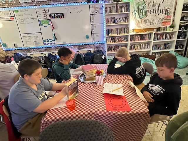 Students sampling books in class at the Book Tasting