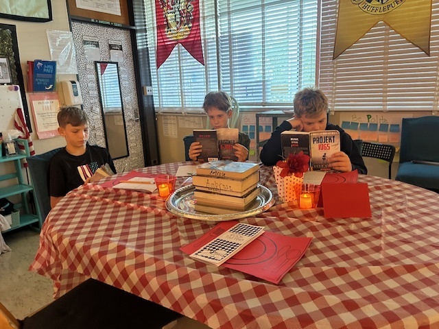 Students sampling books in class at the Book Tasting