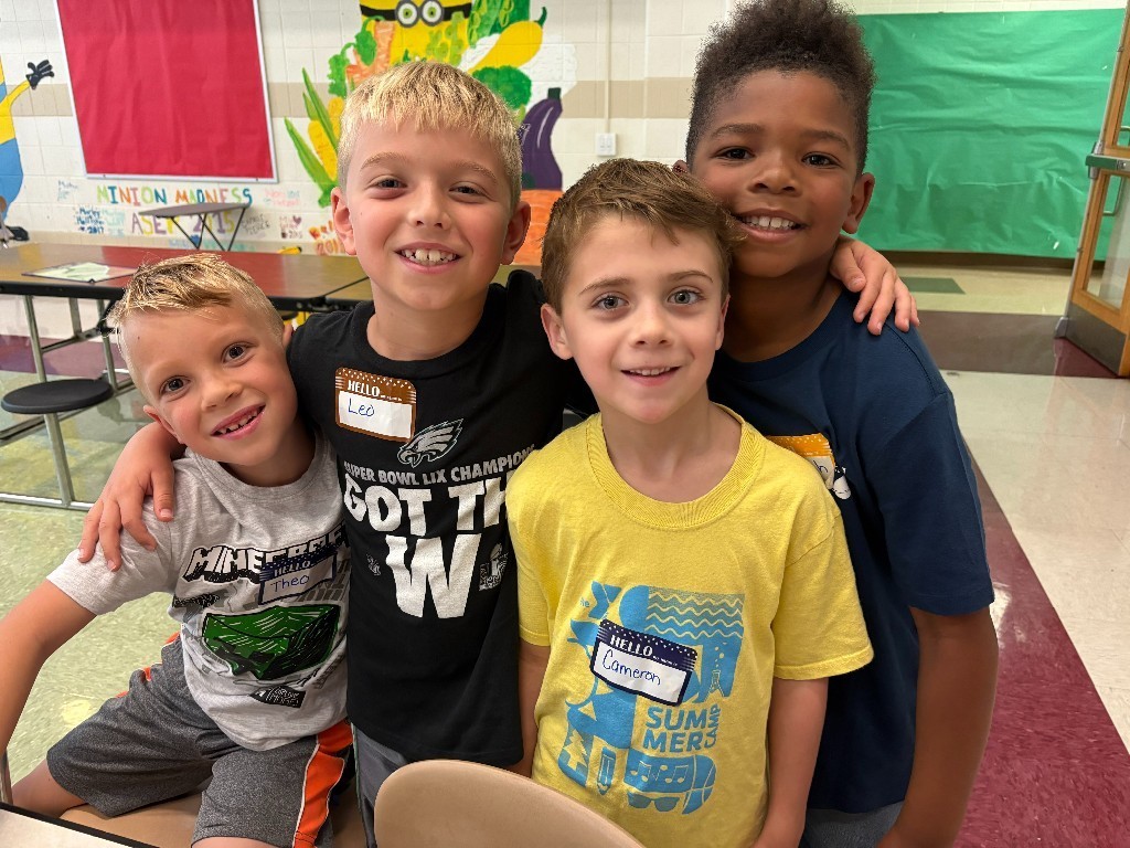 4 Overlook students pose together in friendship during Start With Hello Week