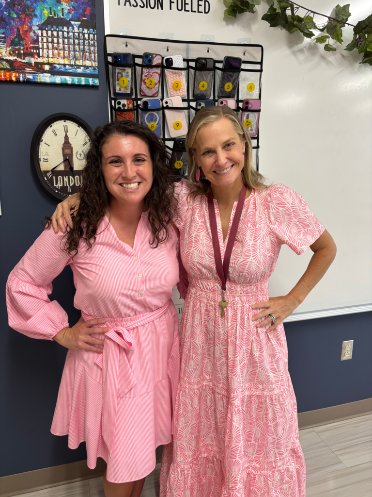 Mrs. Whitman and Mrs. Bowls in their pink dresses