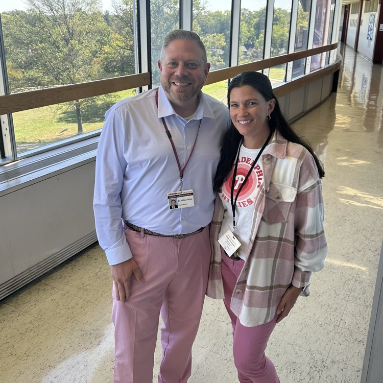 Dr. Fecher wears pink with AMS staff 