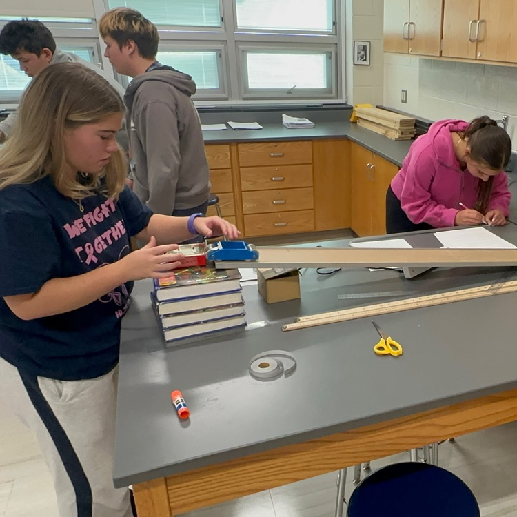 Students conducting acceleration experiments