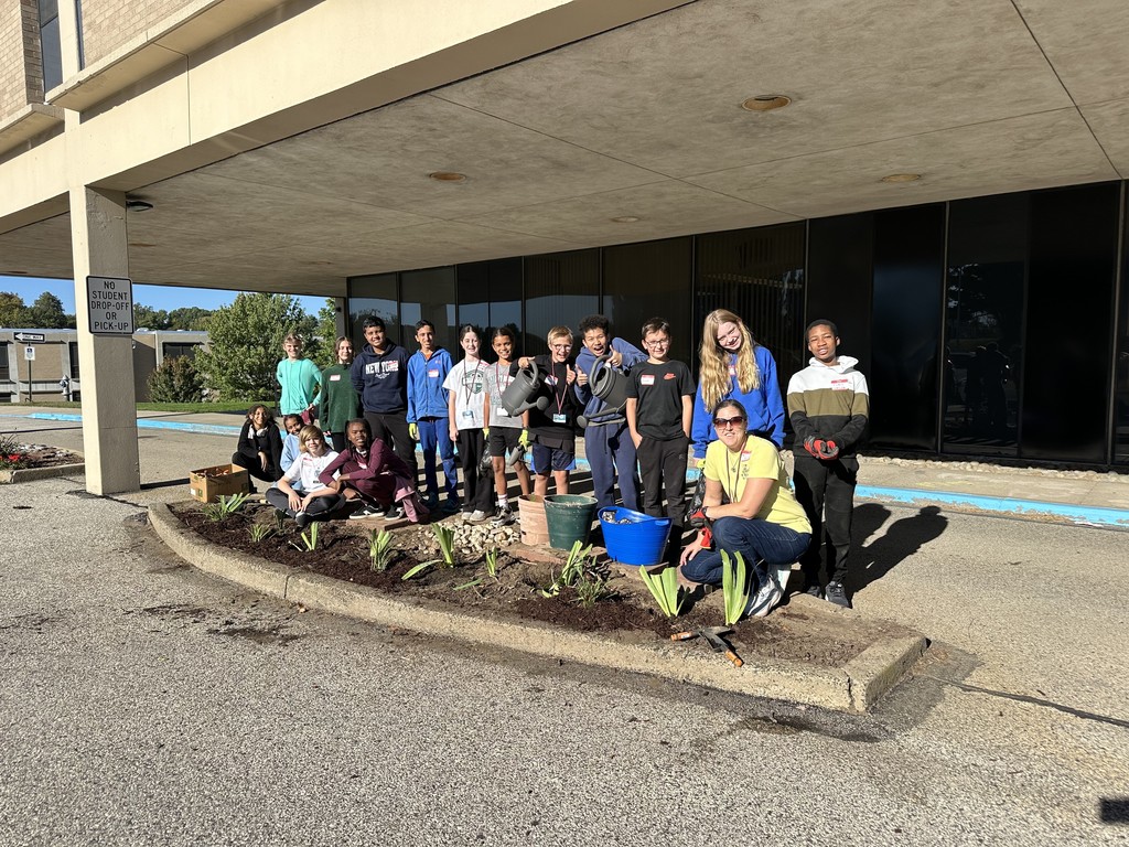 Image of students planting flowers.
