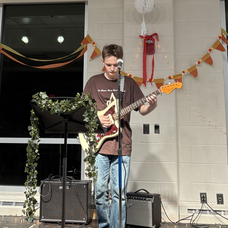students performing at coffee house.