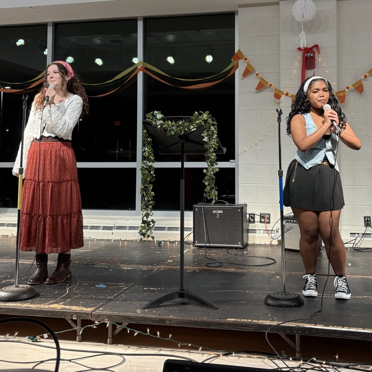 students performing at coffee house.