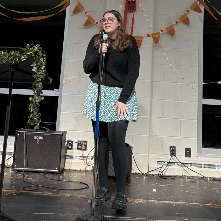 students performing at coffee house.