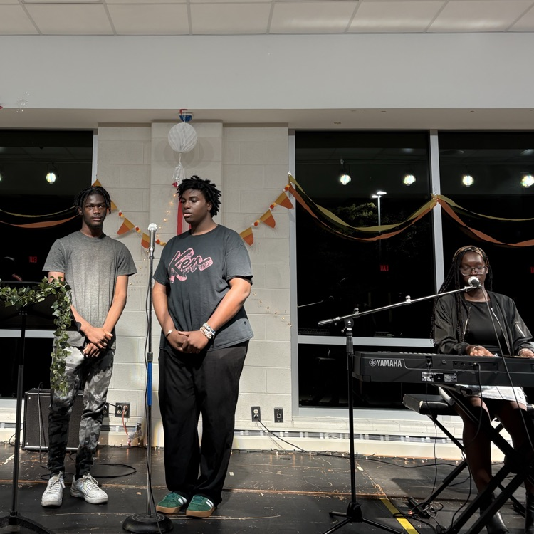 students performing at coffee house.