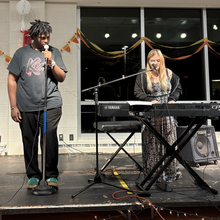 students performing at coffee house.