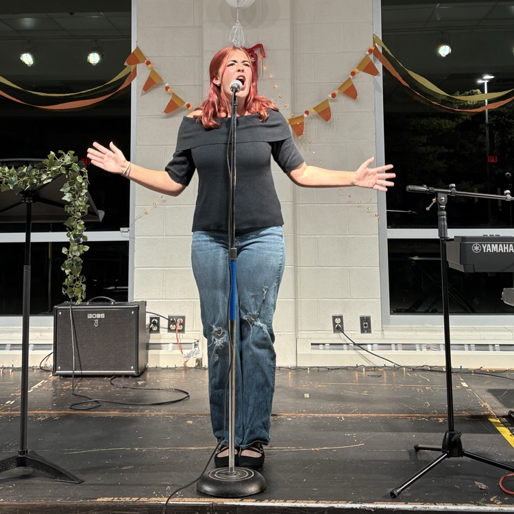 students performing at coffee house.