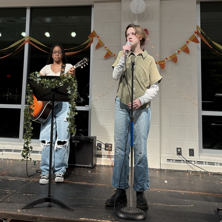 students performing at coffee house.