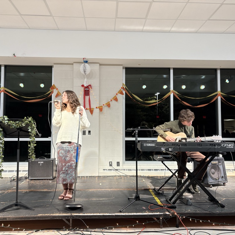 students performing at coffee house.