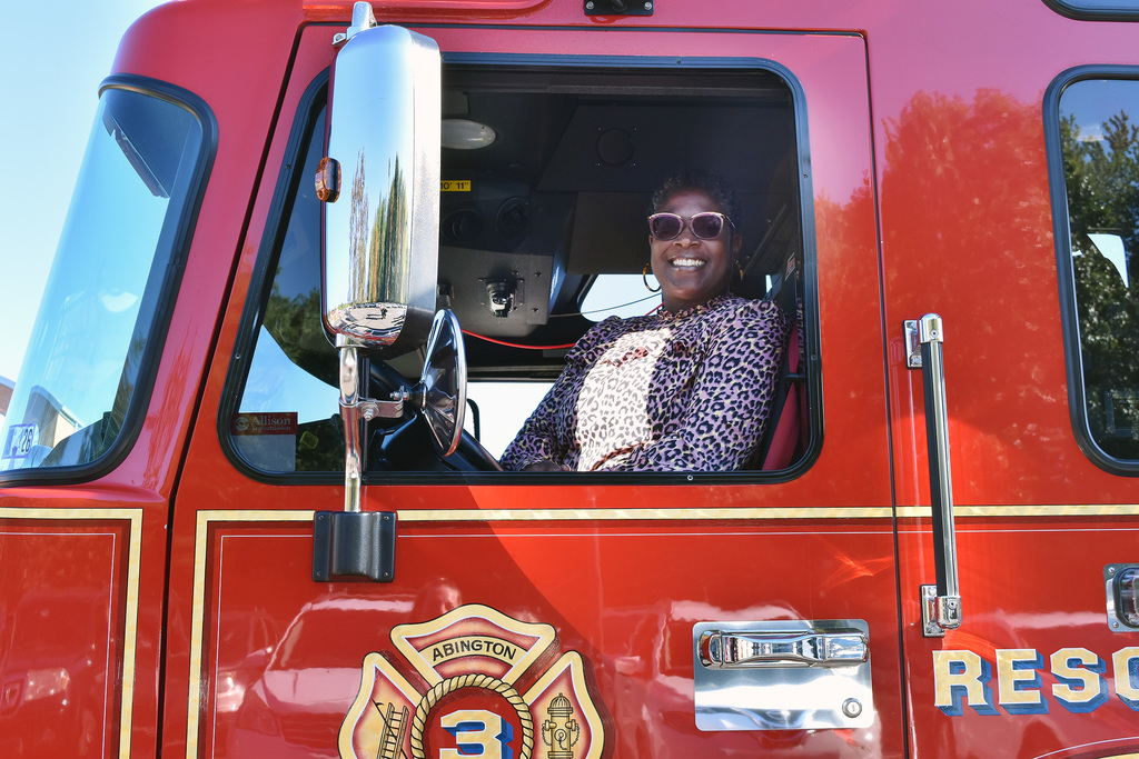 Assistant Principal Doctor sits in the drivers seeat and look out the window of the Weldon fire truck