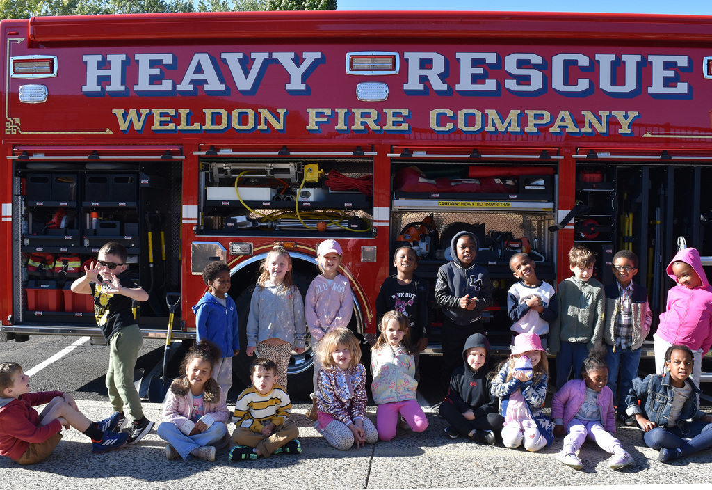 Copper Beech kindergarteners pose as a group in front of the "Heavy Rescue Weldon Fire Company" truck