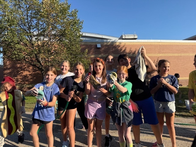 students smiling outside