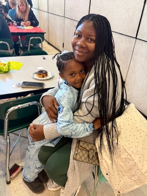 families smiling at Goodies with Guests