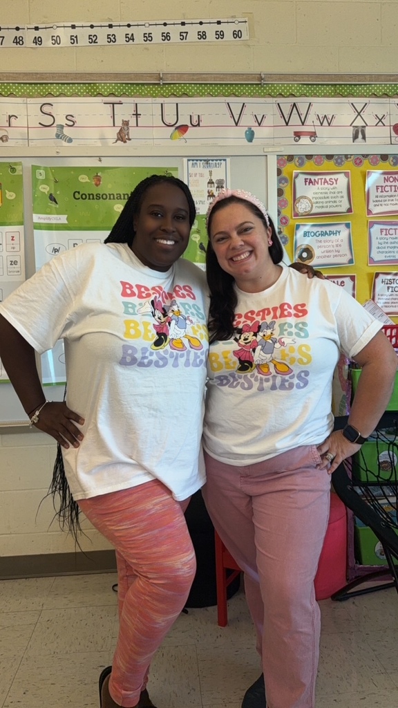 staff smiling in matching outfits