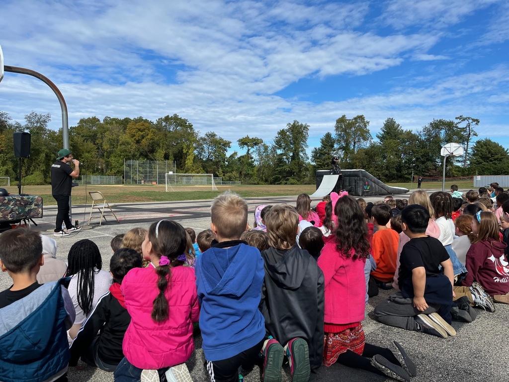 McKinley students watching high‑energy BMX bike stunts.