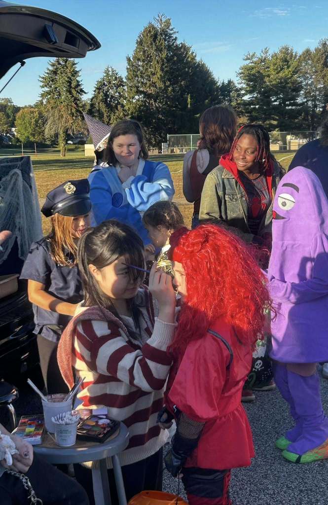 ASHS students interact with the younger Trunk-or-Treaters
