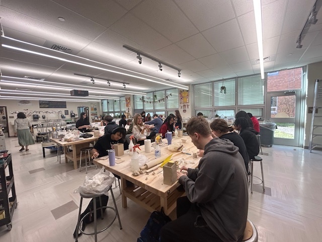 Picture of kids in ceramics doing their work