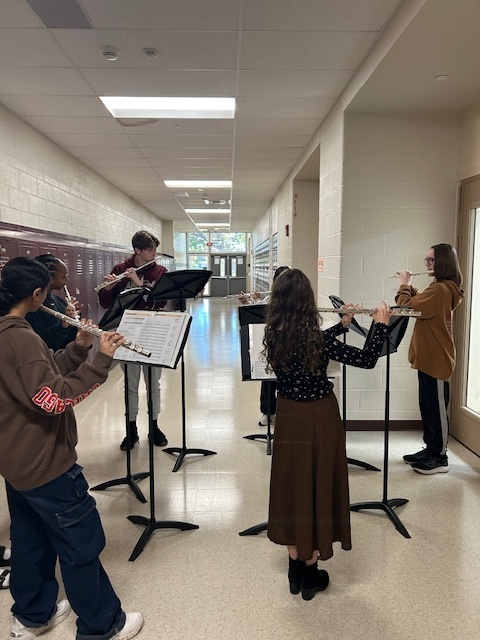 Pictures of kids playing flutes for band