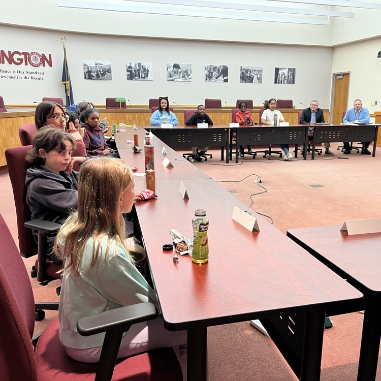 Students discuss and share feedback with Dr. Fecher and Dr. Melchor