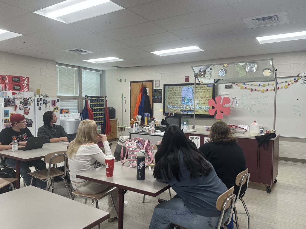Students are attentively watching a movie about macaroni and cheese.