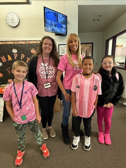 students smiling with staff