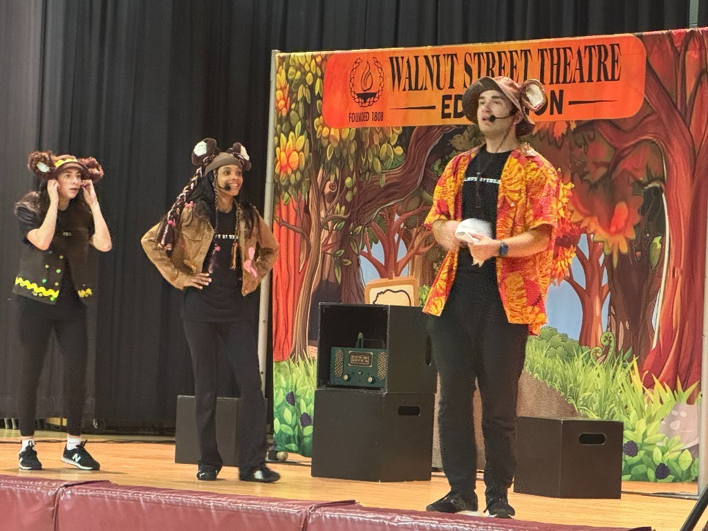 Actors perform on the stage of a Walnut Street Theatre production for students