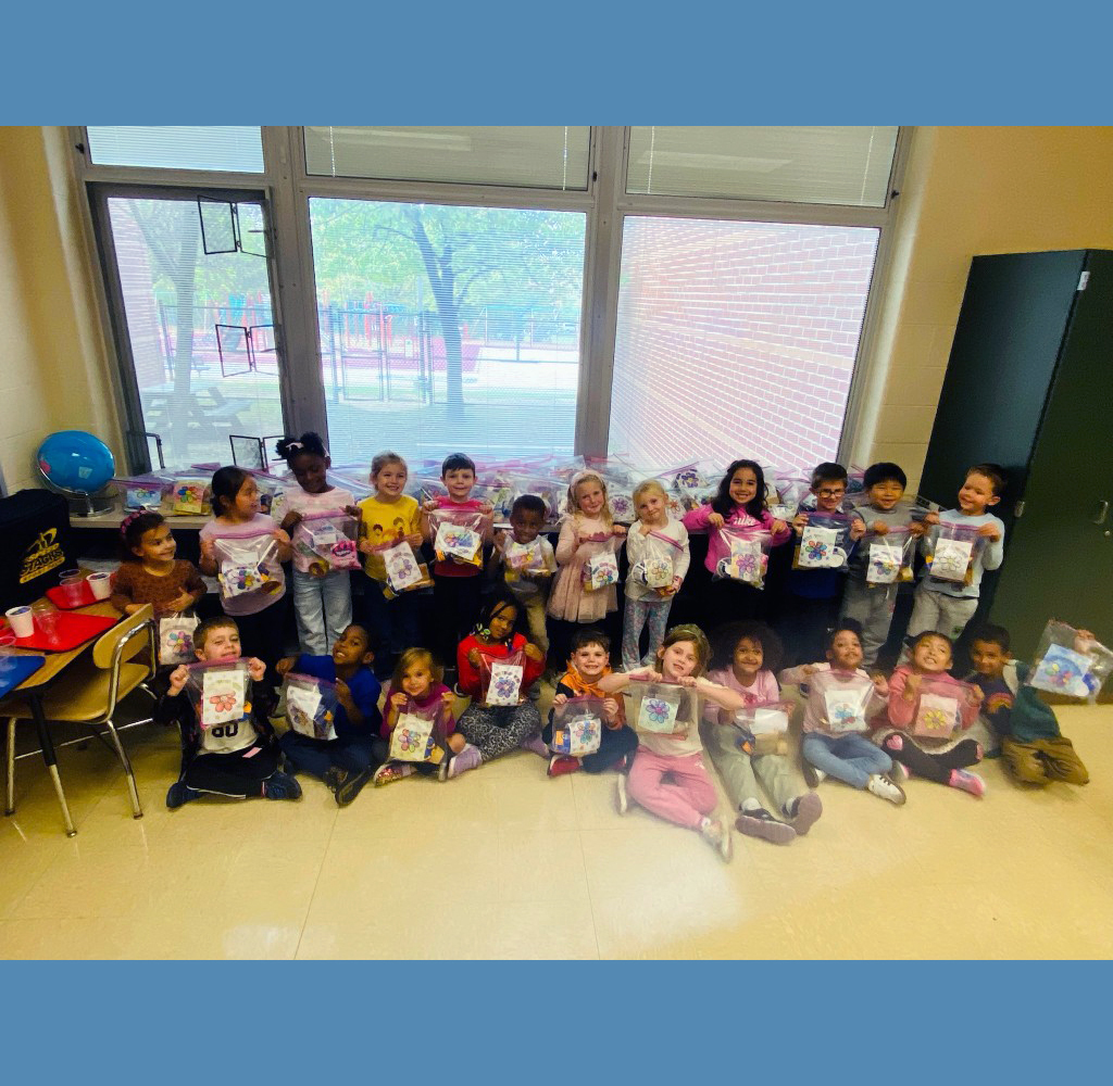 Overlook students pose as a class with the Belly Bags they filled with donated items for the needy
