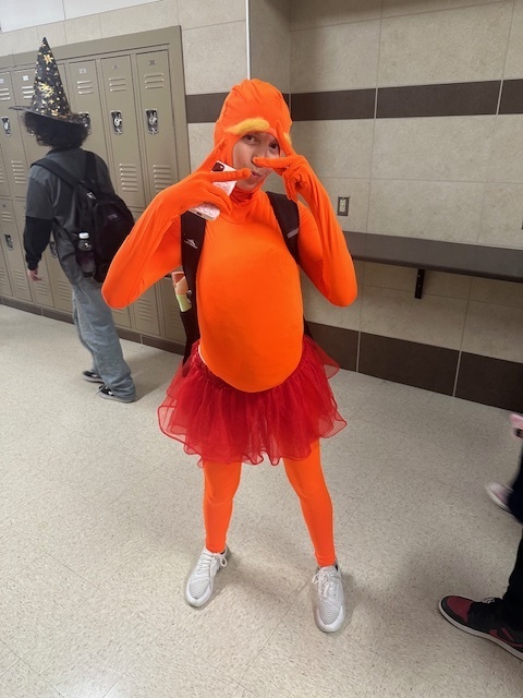 girl dressed like orange monster