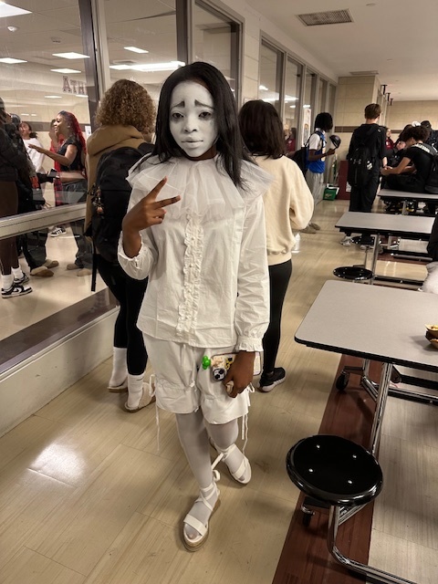 girl in cafeteria A dressed like a sad clown