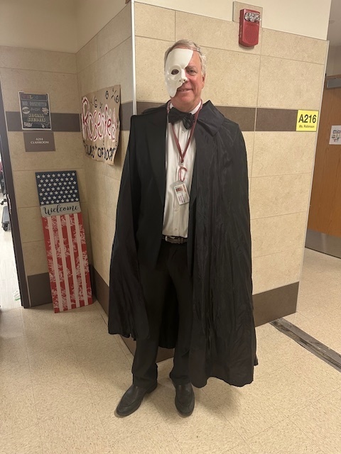 Mr Rosenfeld dressed like man with a mask