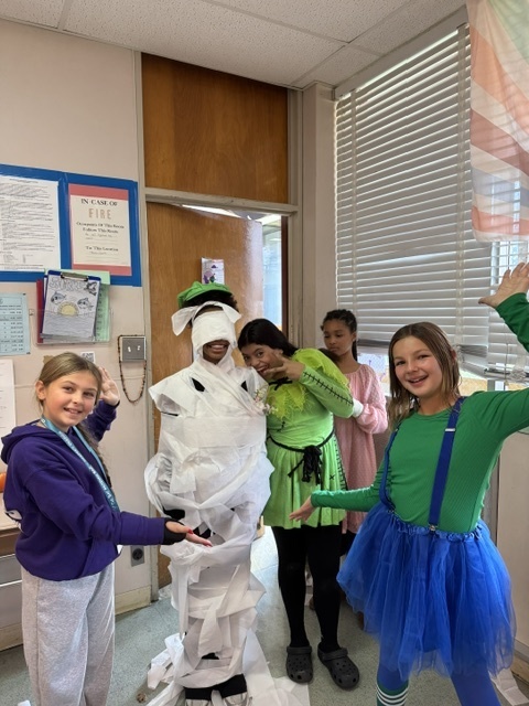 Image of 6th grade students participating in mummy math