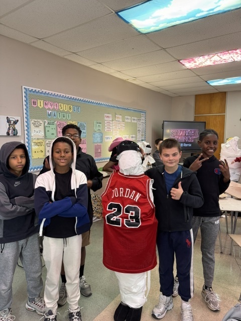 Image of 6th grade students participating in mummy math