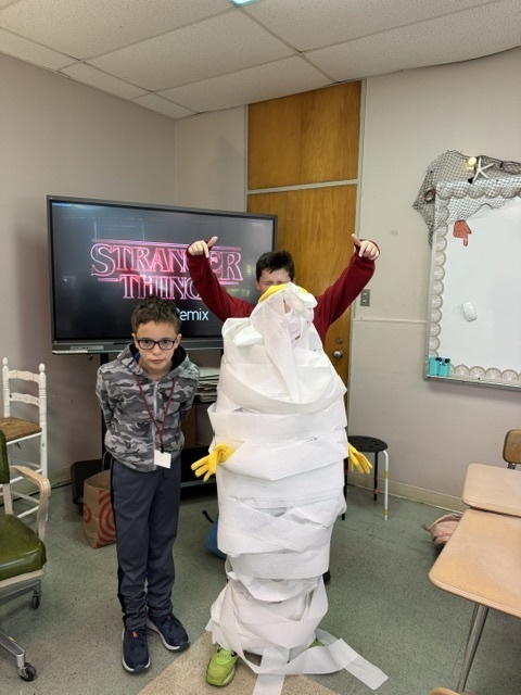 Image of 6th grade students participating in mummy math