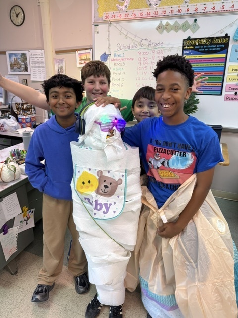 Image of 6th grade students participating in mummy math