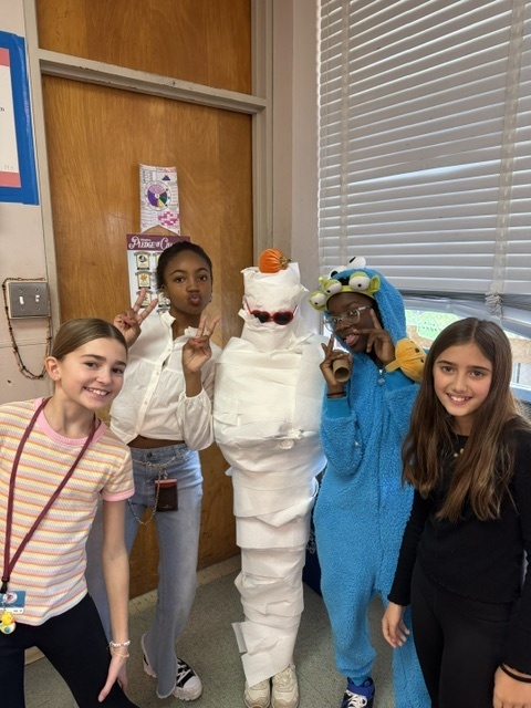 Image of 6th grade students participating in mummy math