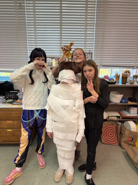 Image of 6th grade students participating in mummy math
