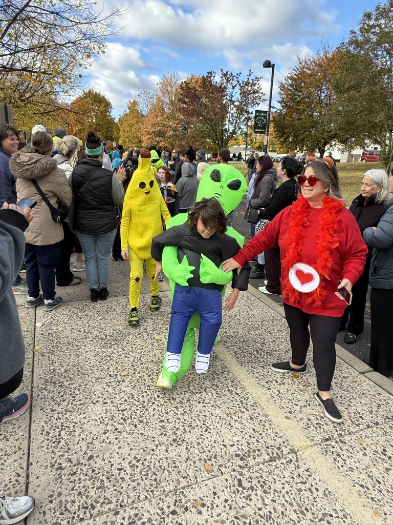 students in their Halloween costumes smiling