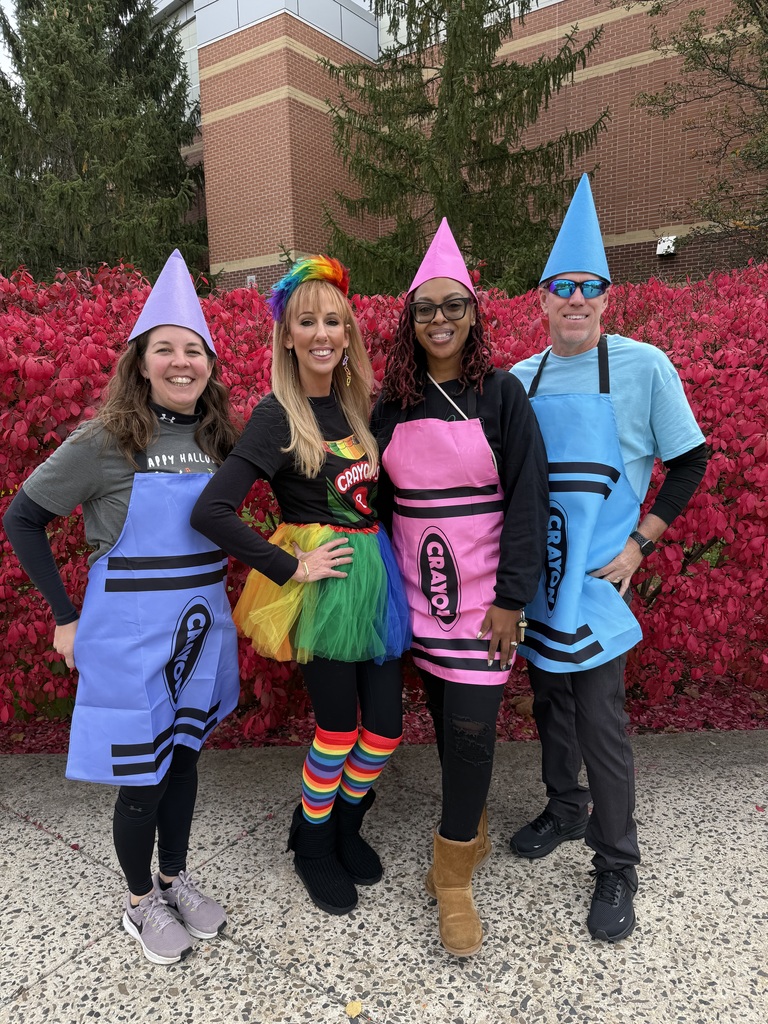staff smiling with their cotumes