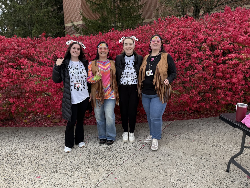 staff smiling with their cotumes