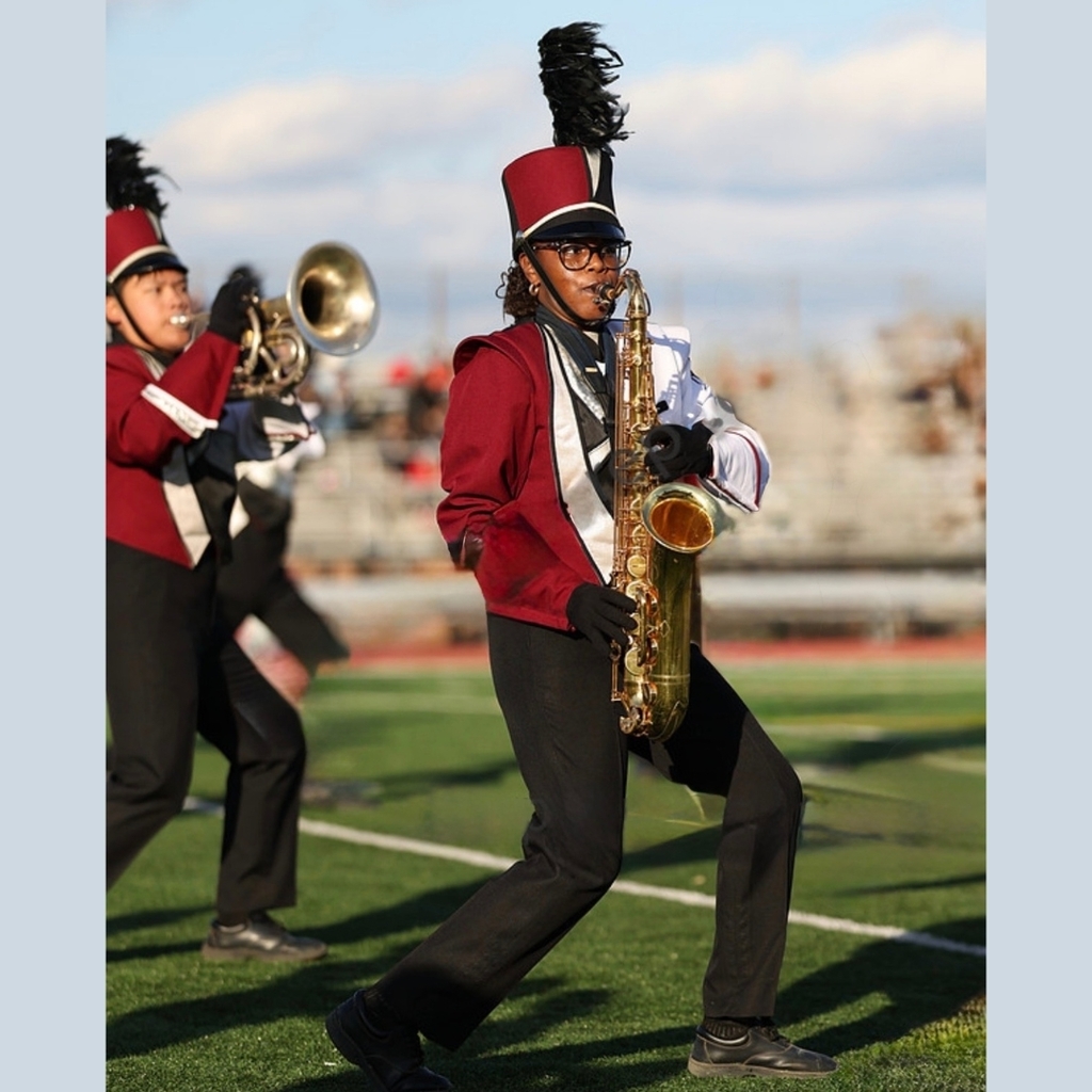 girl playing saxaphone