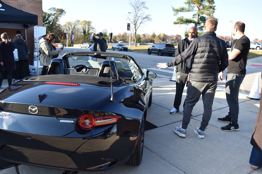 Teachers and staff get ready to test drive the Mazda vehicles