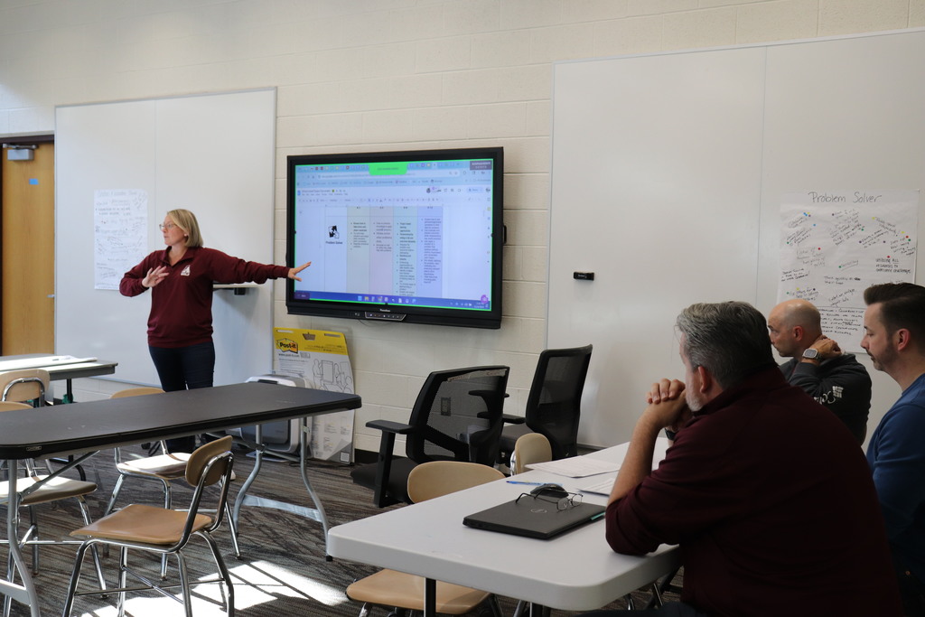 Ms. Laura Enama discusses with the high school about Portrait of a Graduate