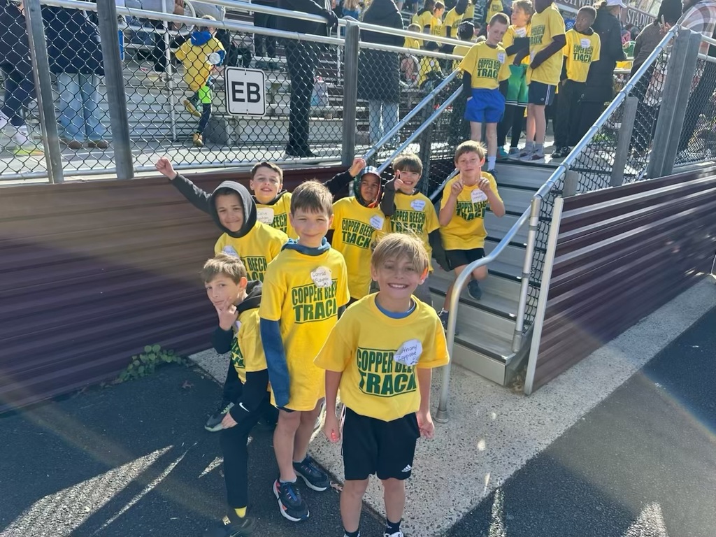 students smiling at the track meet